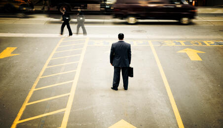 man standing in parking lot